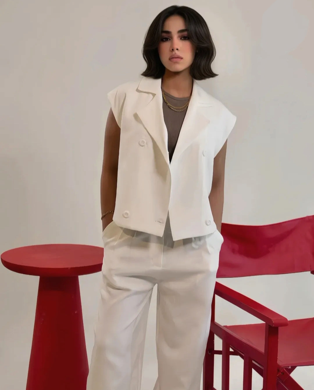 Cream sleeveless double breasted vest